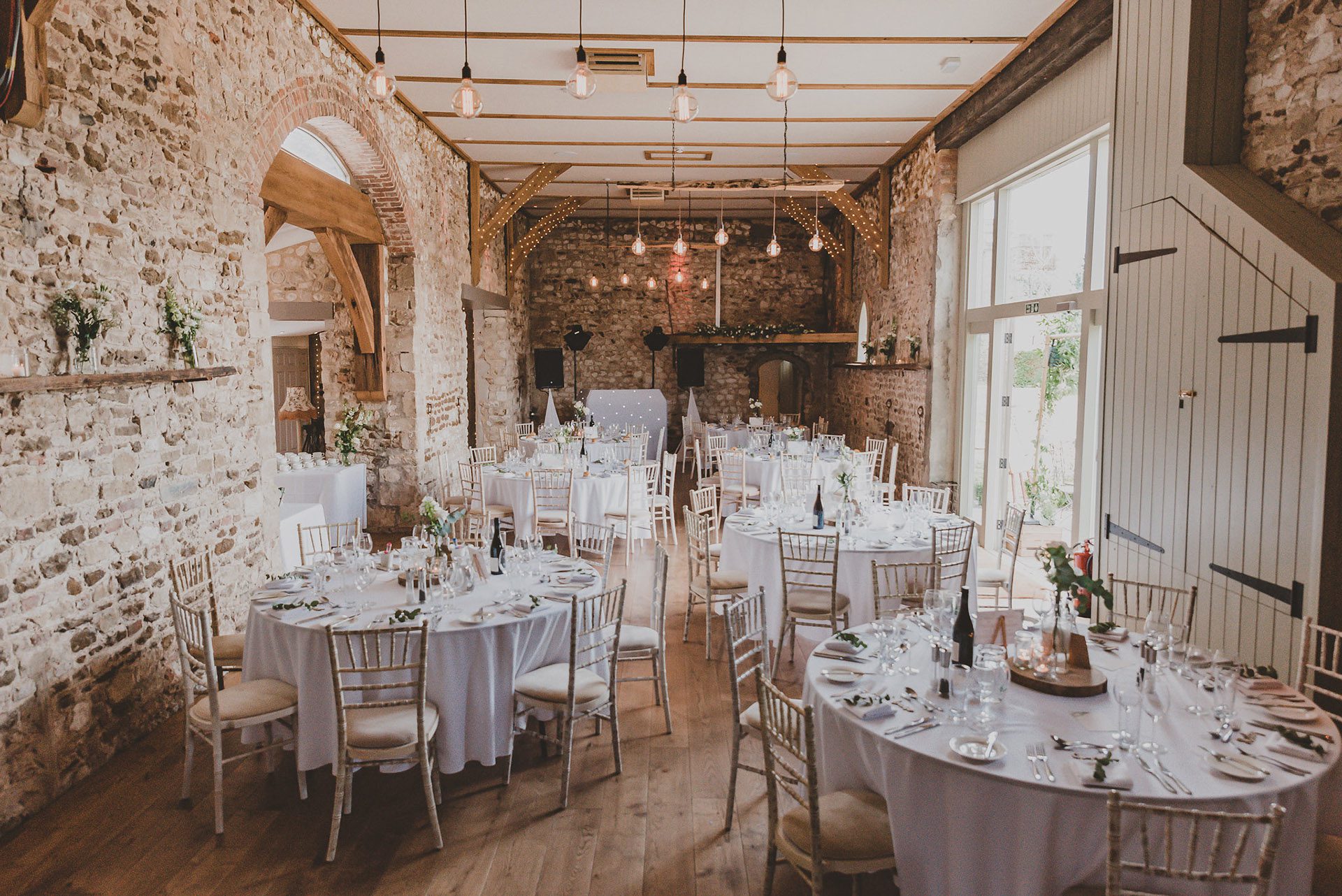 The barn at Pentney Abbey is set up for the wedding breakfast