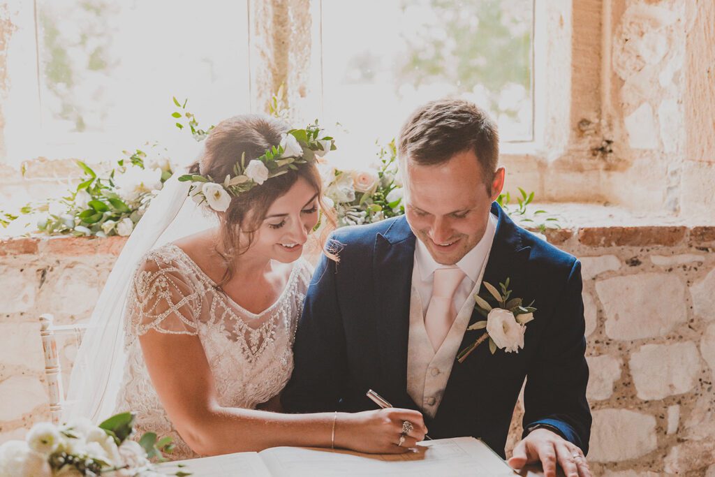 Bride Signing the Register | North Norfolk Barn Wedding | Pentney Abbey